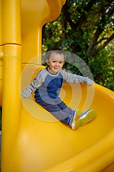 Asian kid on slide