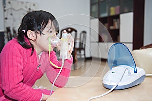 Asian kid taking respiratory