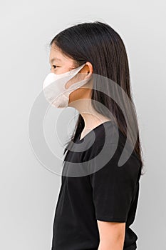 Asian Kid Wearing Mask to Prevent Corona Virus or COVID-19