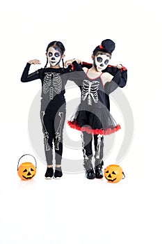 Asian Kids with face-paint and Halloween costumes