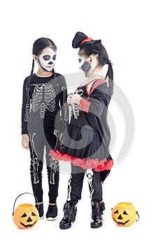 Asian Kids with face-paint and Halloween costumes