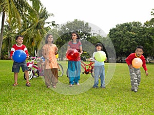 Asian kids playing in the park