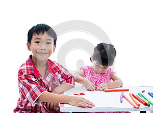 Asian kids playing with play clay on table. Strengthen the image