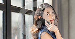 Asian Korean businesswoman using mobile phone