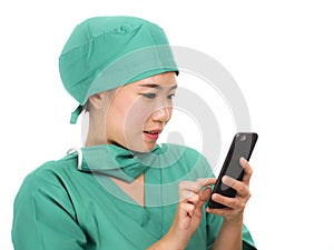 Asian Korean woman as successful physician using hand phone - young beautiful and happy medicine doctor or chief hospital nurse