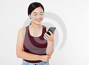 Asian, korean woman is reading pleasant text message on mobile phone from her boyfriend during her rest time, copy space