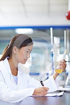 Asian Laboratory scientist working at lab with test tubes