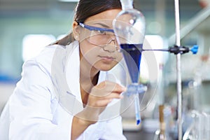 Asian Laboratory scientist working at lab with test tubes