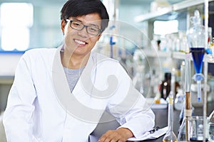 Asian Laboratory scientist working at lab with test tubes