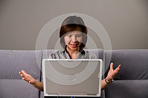 Asian lady in business attire, frustrated