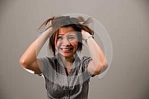 Asian lady in business attire, very frustrated photo