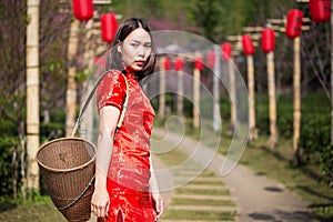 Asian lady portrait relax in Chinese style long dress or vietnam contemporary accessories happy on location morning