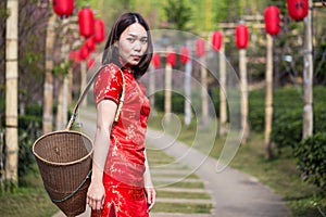 Asian lady portrait relax in Chinese style long dress or vietnam contemporary accessories happy on location morning