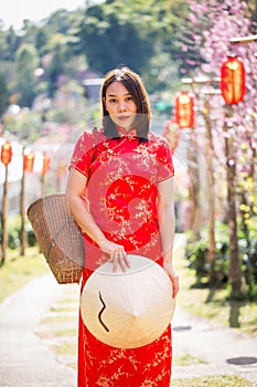 Asian lady portrait relax in Chinese style long dress or vietnam contemporary accessories happy on location morning