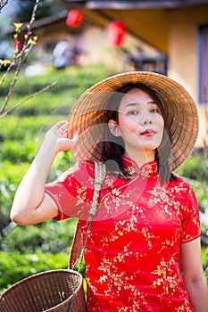 Asian lady portrait relax in Chinese style long dress or vietnam contemporary accessories happy on location morning