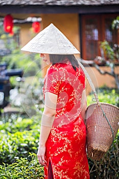 Asian lady portrait relax in Chinese style long dress or vietnam contemporary accessories happy on location morning