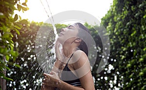 Asian lady shower outdoor for relax.