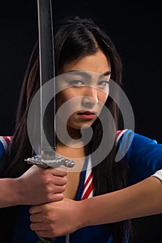 Asian lady with sword in studio