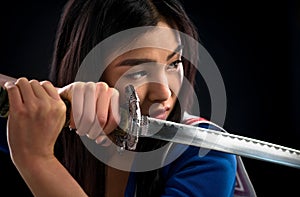 Asian lady with sword in studio