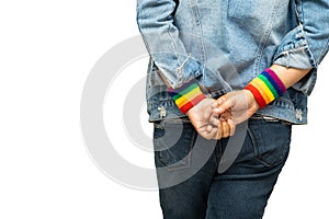 Asian lady wearing rainbow wristbands isolate on white background with clipping path, symbol of LGBT pride month celebrate annual