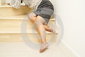 Asian lady woman injuries from falling down on slippery surfaces stairs at home