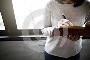 Asian Lady Writing Notebook Diary Concept