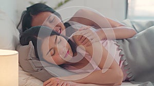 Asian Lesbian lgbtq women couple wake up at home. Young Asia lover female happy relax rest together after sleep all night while
