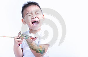 Asian little baby childhood very happy he playing use paintbrush draw watercolor