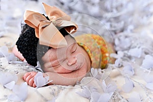 Asian little baby newborn girl sleeping on a lace with flower pattern