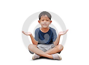 Asian little boy child sitting cross-legged with hands open wide to receive and look straight into camera on white background