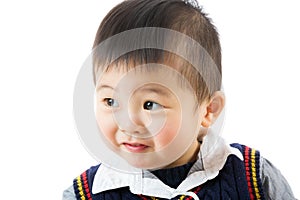 Asian little boy looking at a side