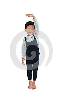 Asian little boy measures the growth on white background. Child estimate her height by hand with looking camera. Image with