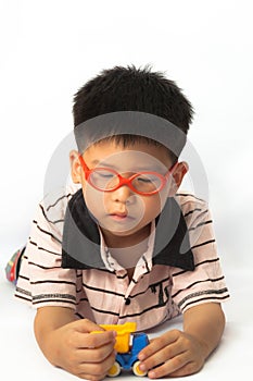 Asian little boy playing toy