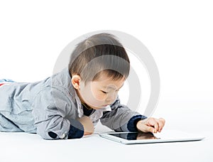 Asian little boy using tablet