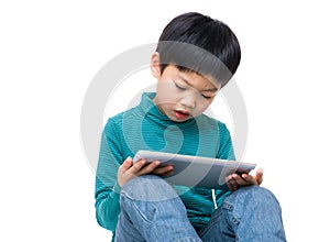 Asian little boy using tablet