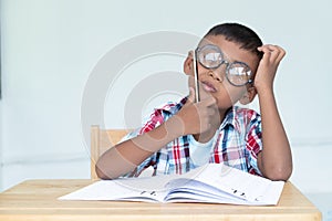 asian little boy write homework