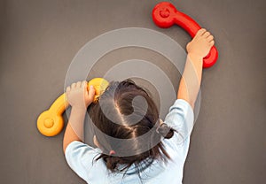 Asian little child girl climbing to slide at playground