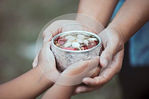 Asian little child girl and mother holding a little bowl