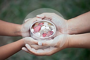 Asian little child girl and mother holding a little bowl