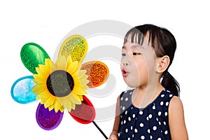 Asian Little Chinese Girl Blowing Colorful Windmill