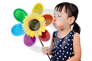 Asian Little Chinese Girl Blowing Colorful Windmill