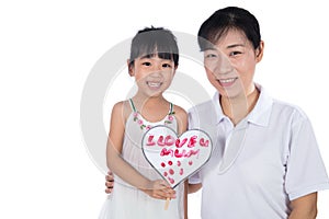 Asian Little Chinese Girl celebrating mother`s day with her mom