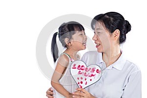 Asian Little Chinese Girl celebrating mother`s day with her mom