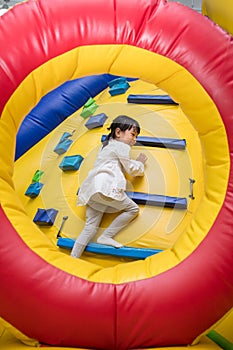 Asian Little Chinese Girl climbing up ramp