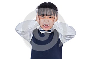 Asian Little Chinese Girl covering her ears with hands