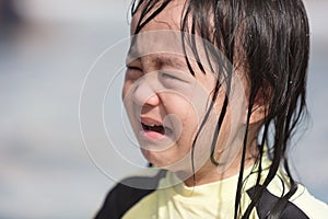 Asian Little Chinese Girl crying in Swimming Pool