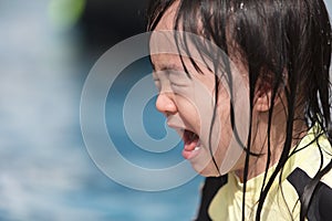 Asian Little Chinese Girl crying in Swimming Pool