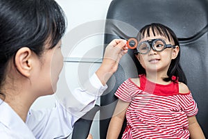 Asian Little Chinese Girl Doing Eyes Examination by ophthalmologist