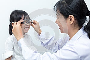 Asian Little Chinese Girl Doing Eyes Examination by ophthalmologist