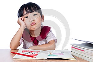 Asian Little Chinese girl drawing with color pencils